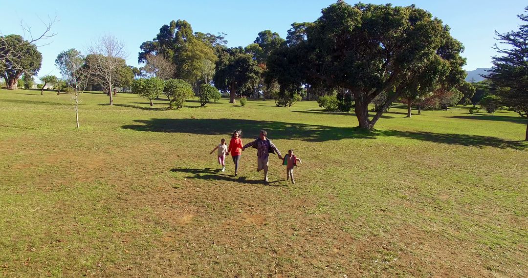 Family Enjoying Nature Walk in Park - Free Images, Stock Photos and Pictures on Pikwizard.com