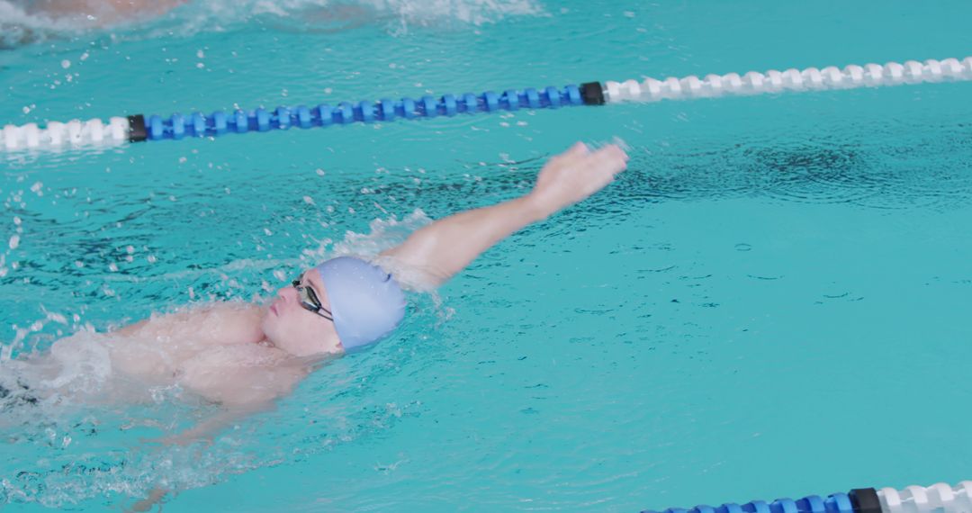 Swimmer Practicing Backstroke in Swimming Pool - Free Images, Stock Photos and Pictures on Pikwizard.com