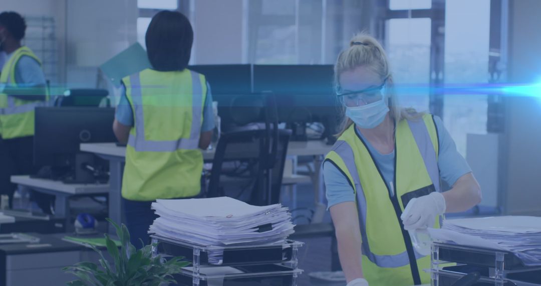 Worker Sanitizing Office for COVID-19 Safety Measures