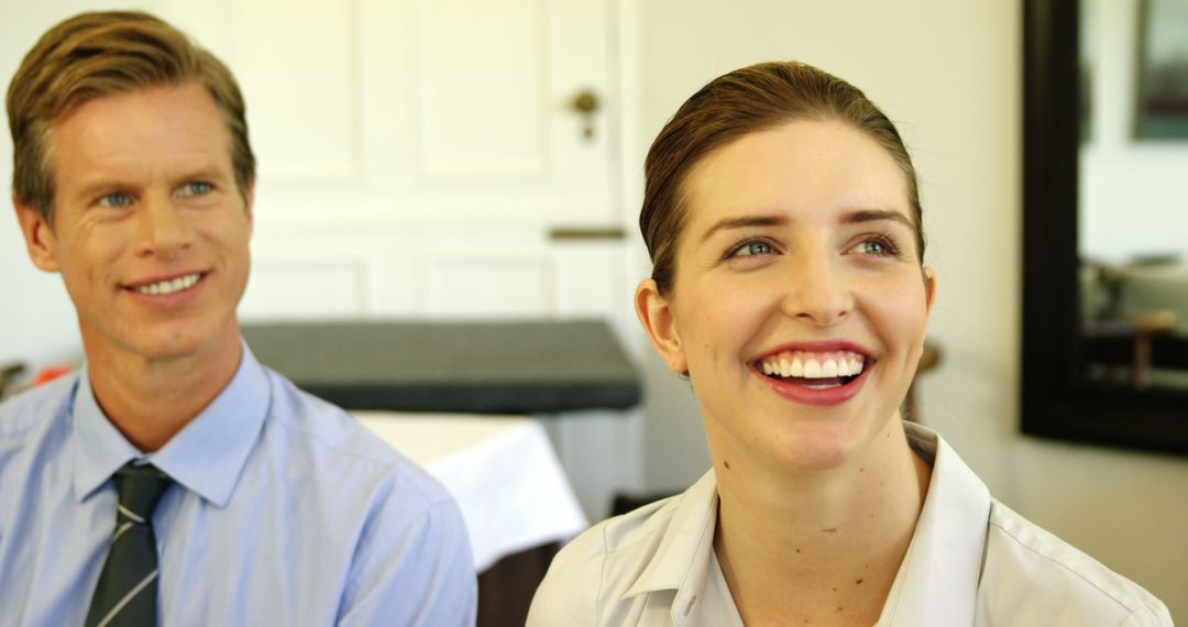 Smiling Business Colleagues in Office Setting - Free Images, Stock Photos and Pictures on Pikwizard.com