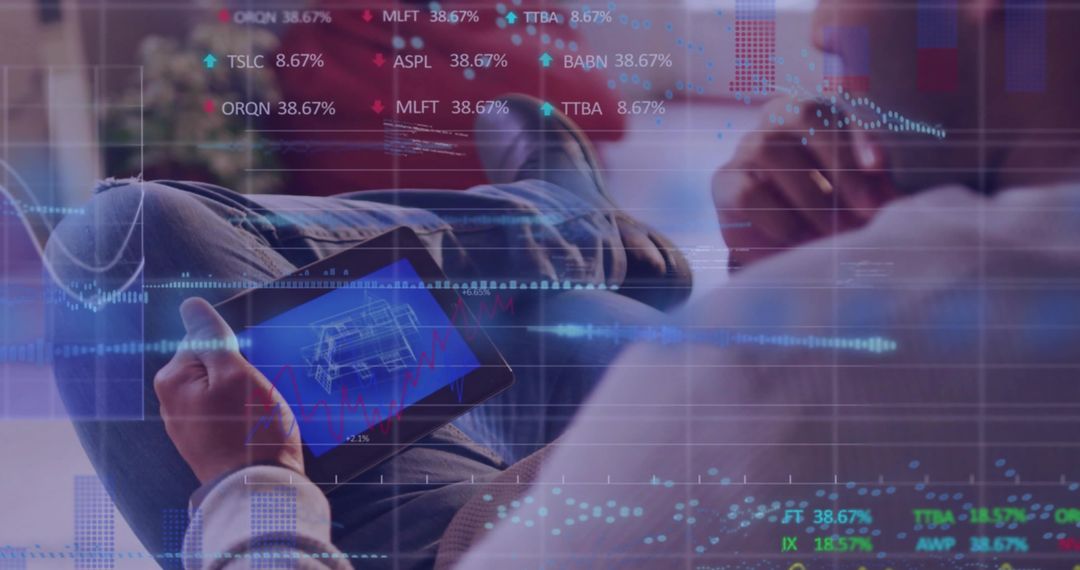 Reclining Asian man reviewing technical blueprint on tablet with augmented data overlays