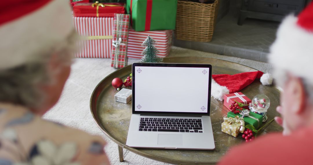 Seniors Video Calling Family During Christmas Celebration - Free Images, Stock Photos and Pictures on Pikwizard.com