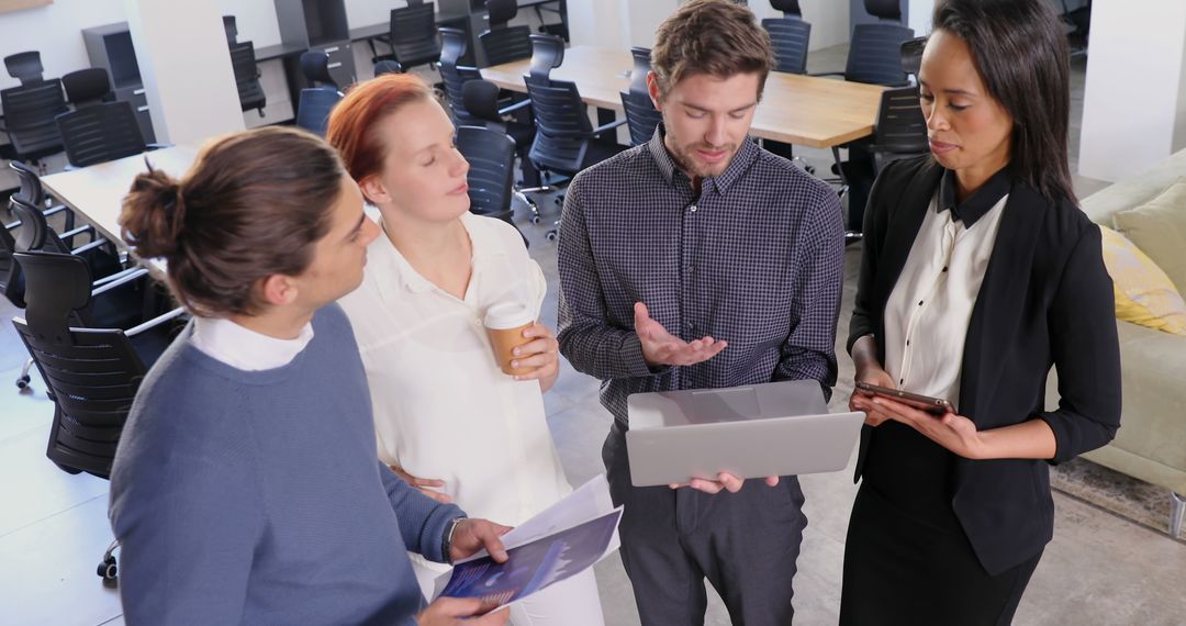Diverse Professionals Collaborating in Office on Project