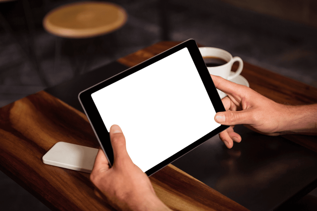 Hands Holding Transparent Tablet at Wooden Cafe Table - Download Free Stock Images Pikwizard.com