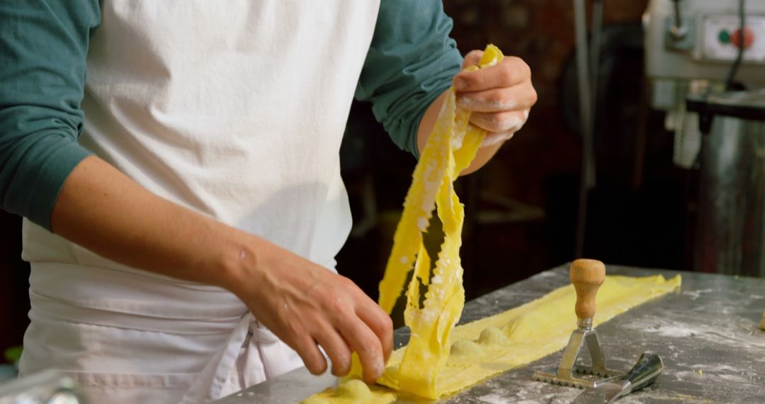 Chef Preparing Fresh Homemade Pasta in a Rustic Kitchen - Free Images, Stock Photos and Pictures on Pikwizard.com