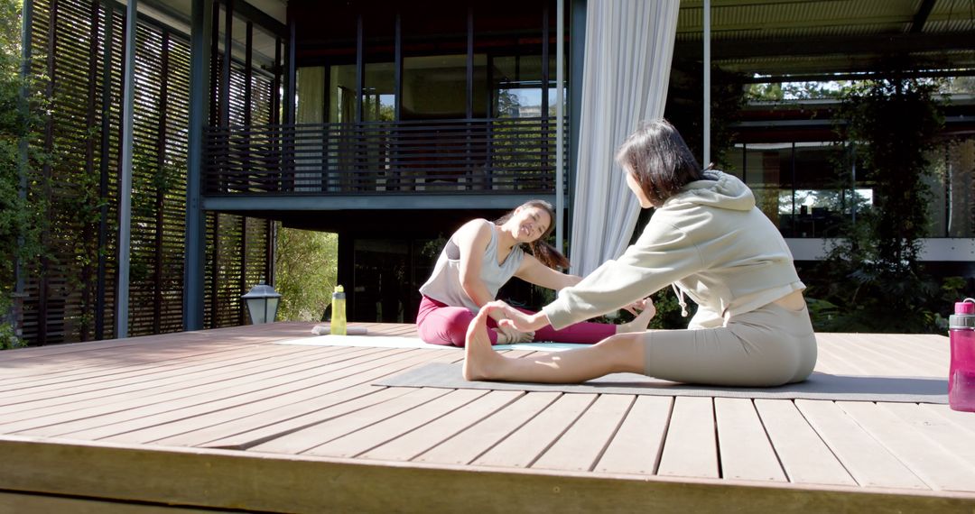 Women Stretching During Outdoor Yoga Session on Sunny Morning - Free Images, Stock Photos and Pictures on Pikwizard.com