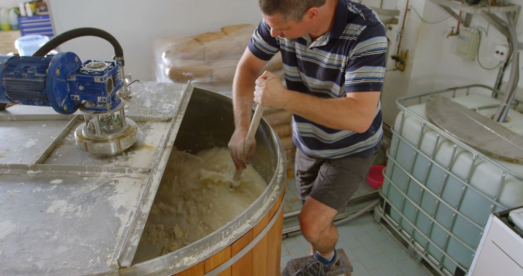 Worker Mixing Ingredients in Industrial Cheese Making Process - Free Images, Stock Photos and Pictures on Pikwizard.com