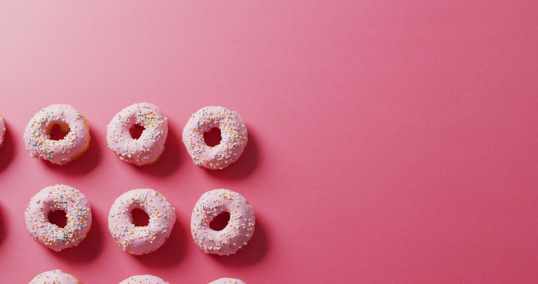 Image of donuts with icing on pink background - Free Images, Stock Photos and Pictures on Pikwizard.com