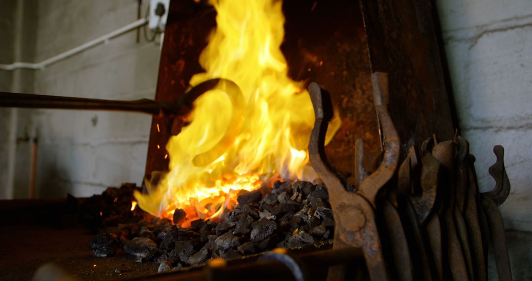 Blacksmith Forging Metal in Traditional Workshop - Free Images, Stock Photos and Pictures on Pikwizard.com