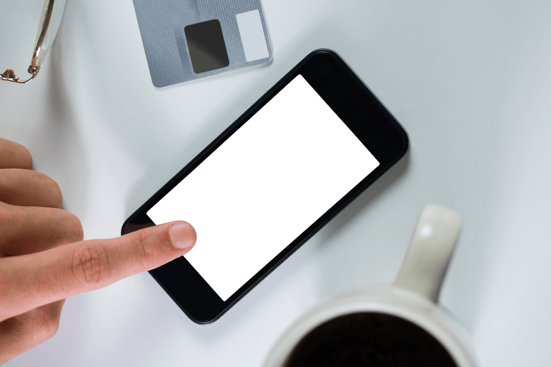 Hand Touching Smartphone Transparent with Coffee and Card
