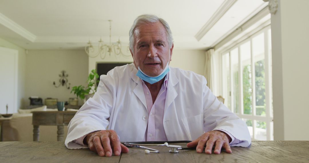 Senior Male Dentist in White Coat Holding Dental Tools - Free Images, Stock Photos and Pictures on Pikwizard.com