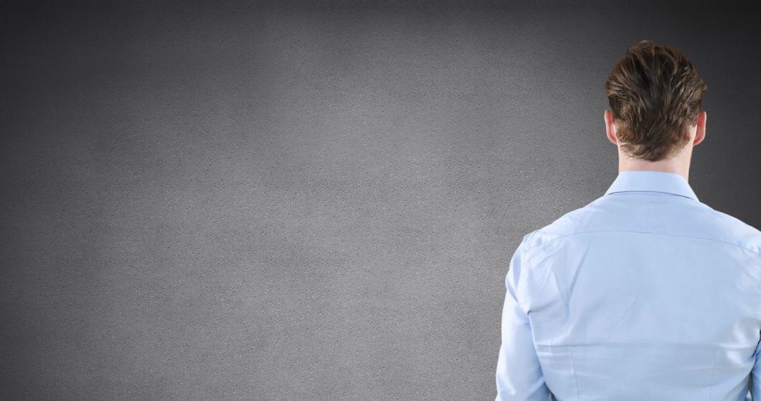 Businessman Interacts with Digital Interface on Grey Background