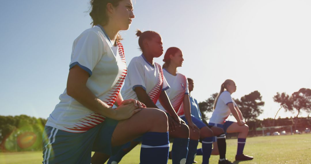 Female Soccer Players Warming Up on Pitch at Sunset - Free Images, Stock Photos and Pictures on Pikwizard.com