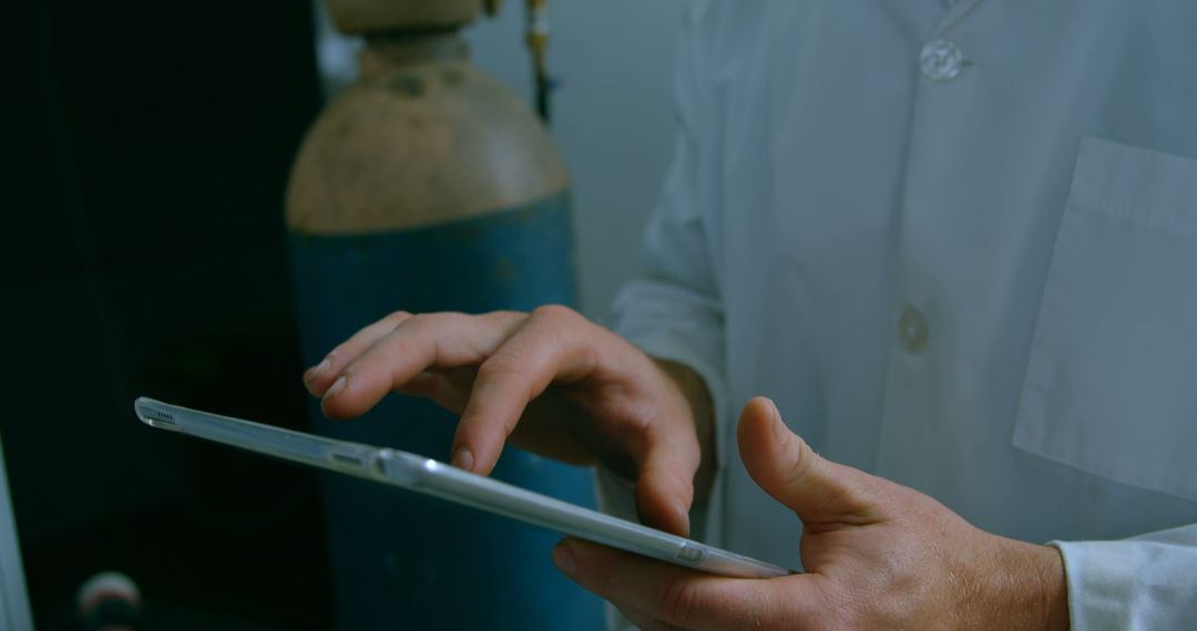 Scientist Using Tablet Computer in Modern Laboratory - Free Images, Stock Photos and Pictures on Pikwizard.com