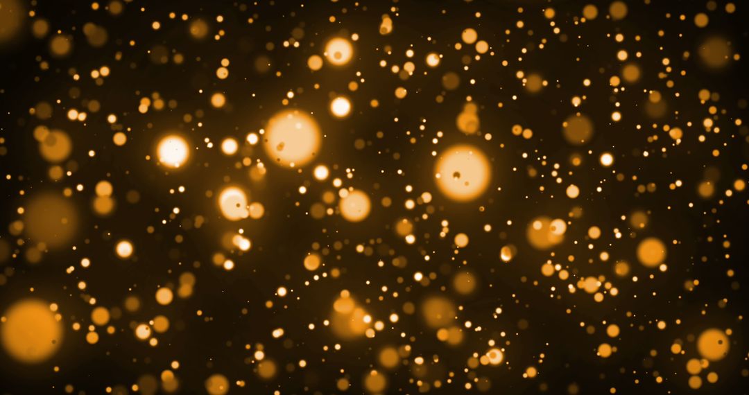 Glowing Orange Sparkles Over Dark Background