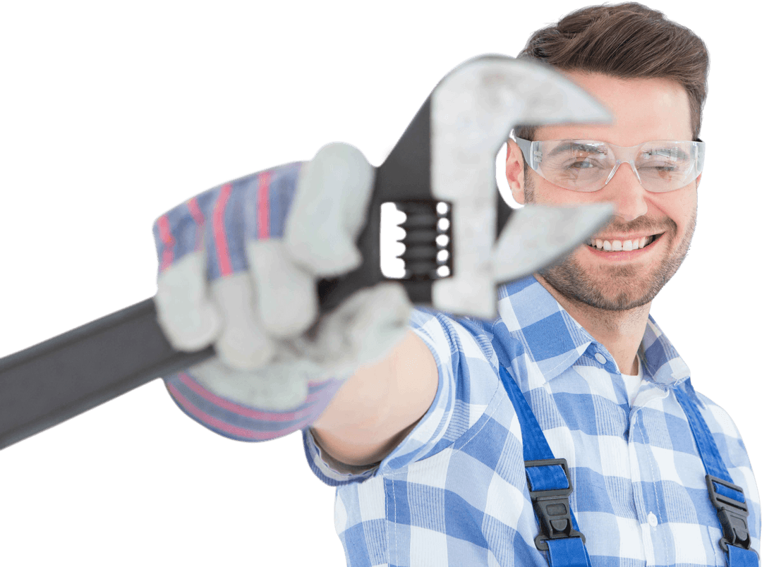 Confident Handyman Smiling With Large Wrench and Protective Glasses Transparent