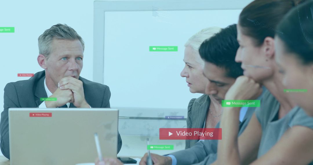 Team Collaboration During Business Meeting with Technology