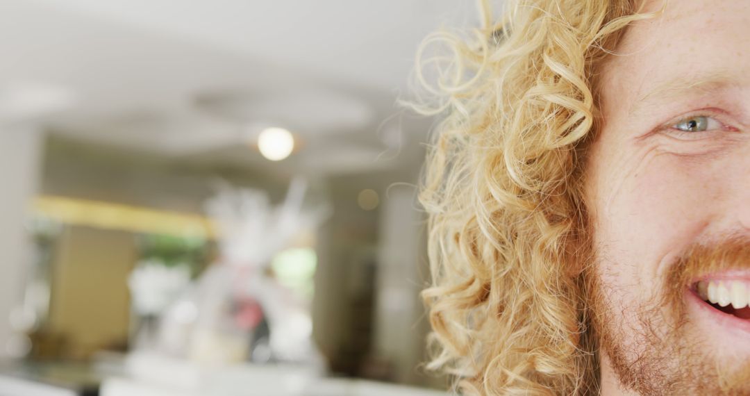 Close-up of Man with Blonde Curly Hair and Beard Smiling - Free Images, Stock Photos and Pictures on Pikwizard.com