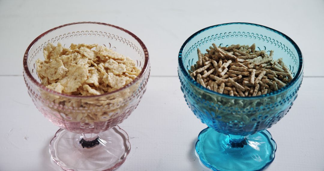 Two Types of Breakfast Cereals in Glass Bowls on White Table - Free Images, Stock Photos and Pictures on Pikwizard.com