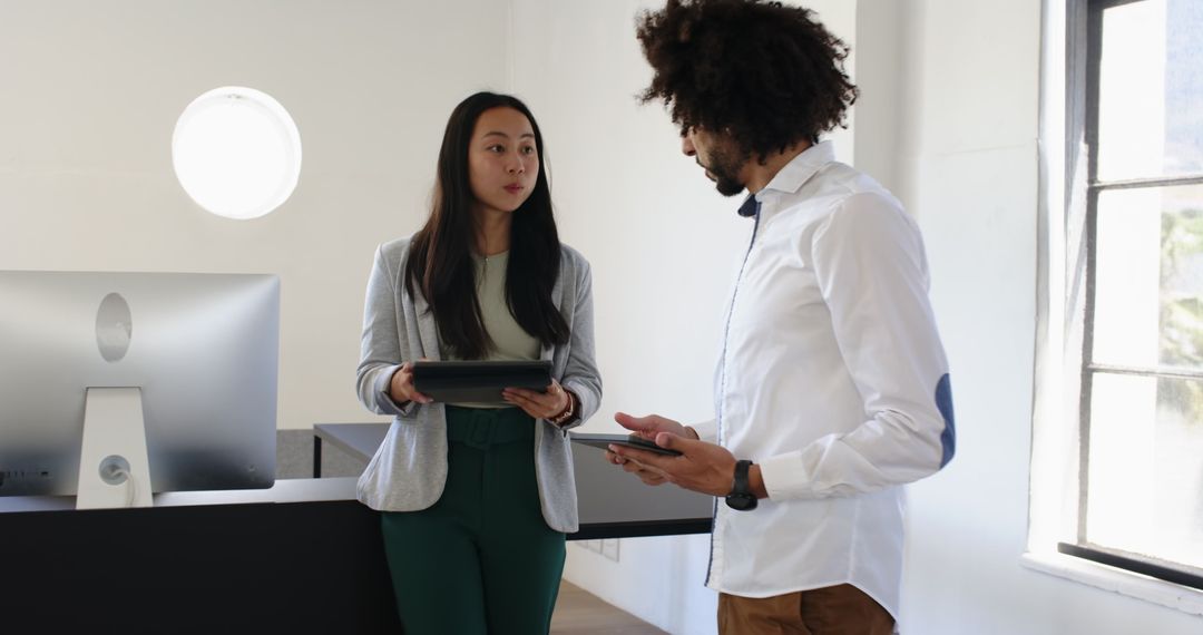 Multicultural Colleagues Collaborate in Modern Office Environment