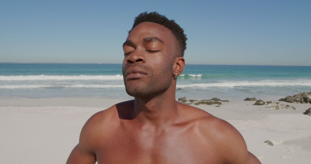 Serene African American Man Relaxing on Sunny Beachfront