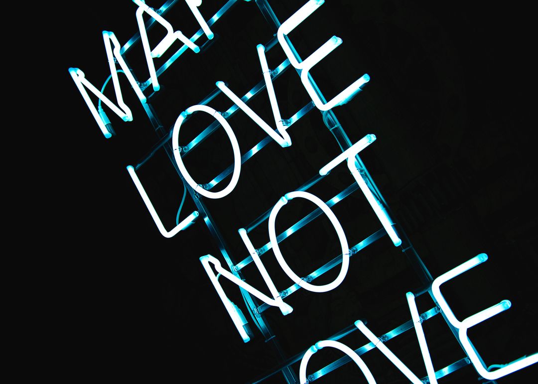 Neon Sign with Quote 'Make Love Not War' - Free Images, Stock Photos and Pictures on Pikwizard.com
