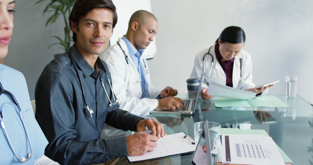 Diverse Medical Team Collaborating in Meeting Room - Free Images, Stock Photos and Pictures on Pikwizard.com