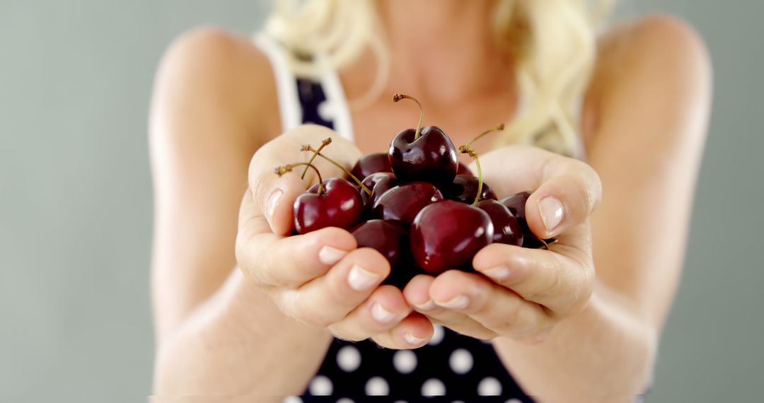 Close-up of Woman's Hands Holding Fresh Cherries - Free Images, Stock Photos and Pictures on Pikwizard.com