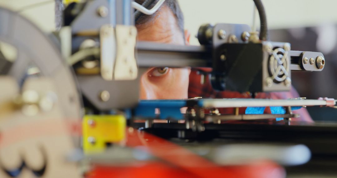 Focused Engineer Adjusting 3D Printer Machine - Free Images, Stock Photos and Pictures on Pikwizard.com