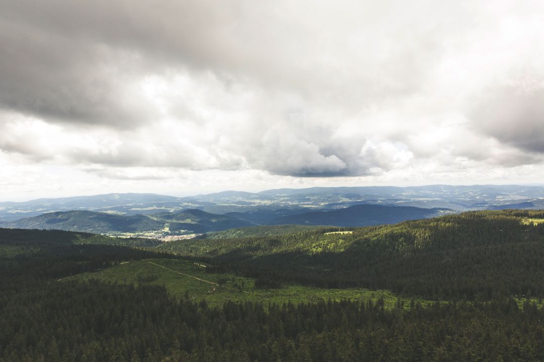 Overcast Sky Above Lush Green Mountain Landscape - Free Images, Stock Photos and Pictures on Pikwizard.com