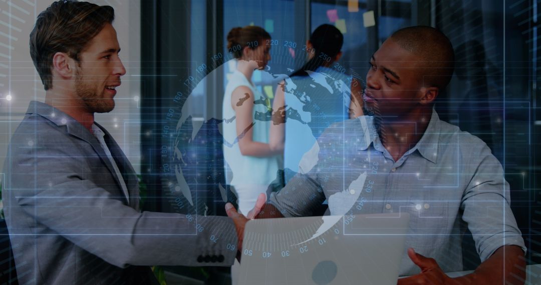 Business Professionals Shaking Hands in Technology Context