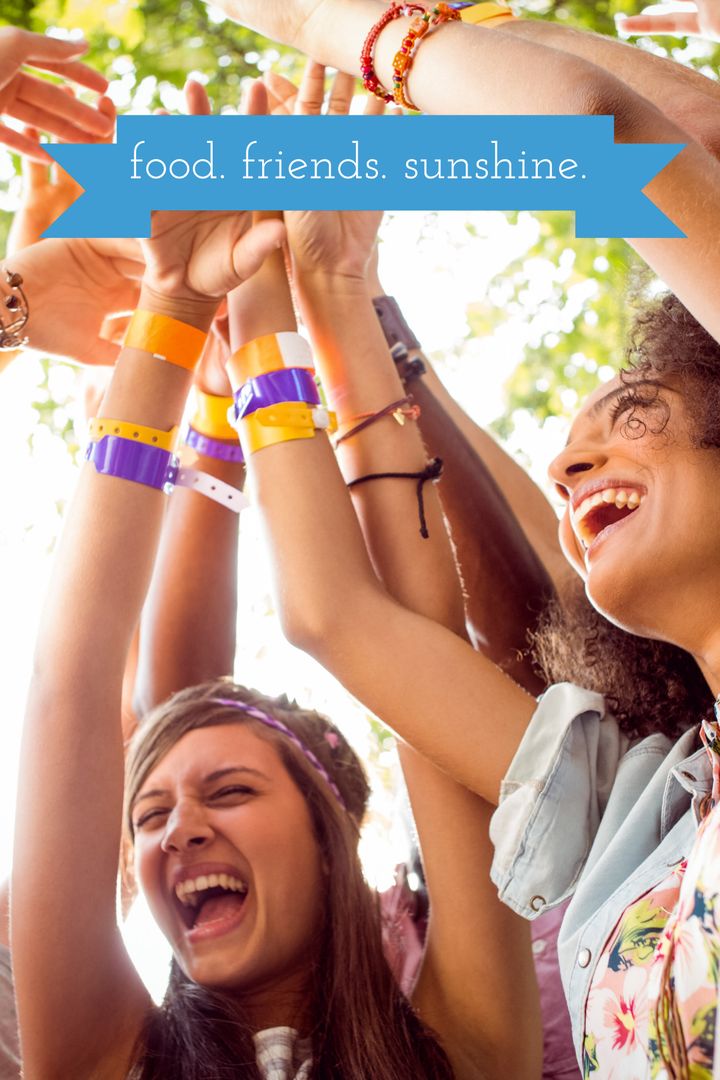 Joyful Group Celebration Under Sunny Sky