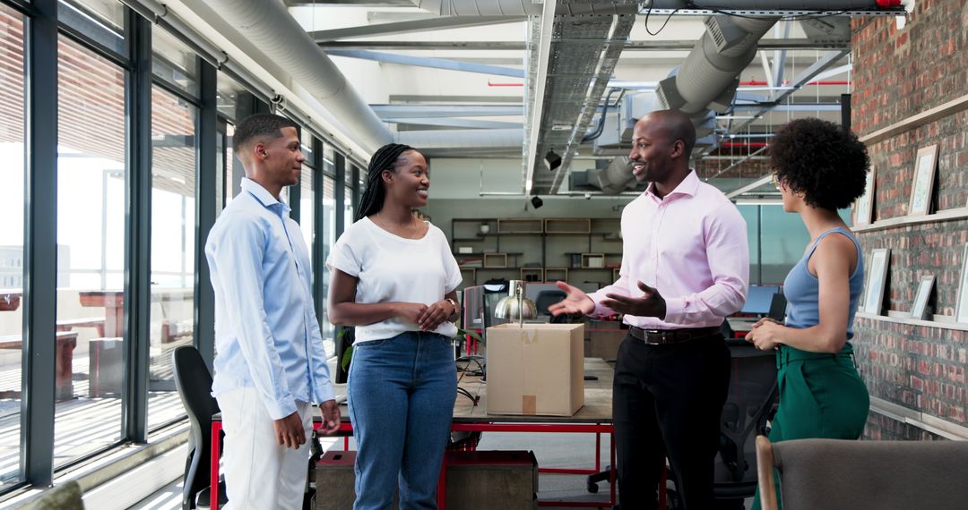 Office Team Welcoming New Coworker with Excitement and Boxes