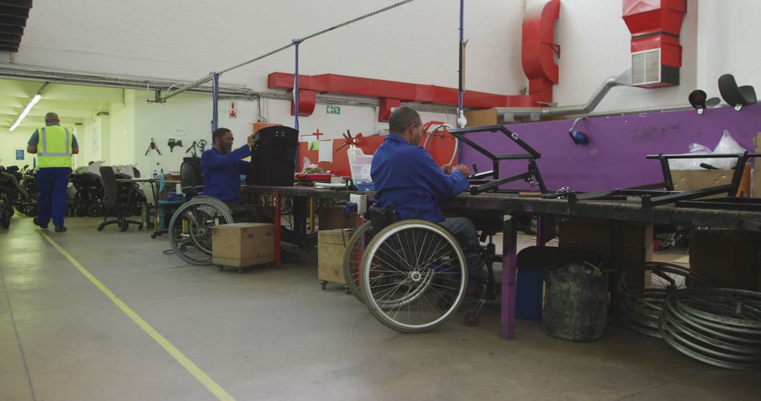 Workers with Disabilities Assembling Products in Factory - Free Images, Stock Photos and Pictures on Pikwizard.com