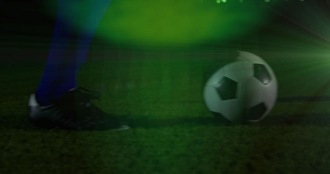 Soccer Ball and Player in Action with Dynamic Lighting Effects
