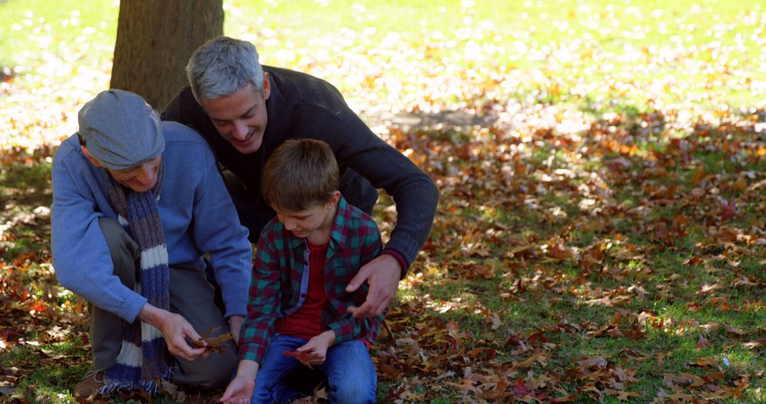 Multigenerational Family Collecting Leaves in Autumn Park - Free Images, Stock Photos and Pictures on Pikwizard.com