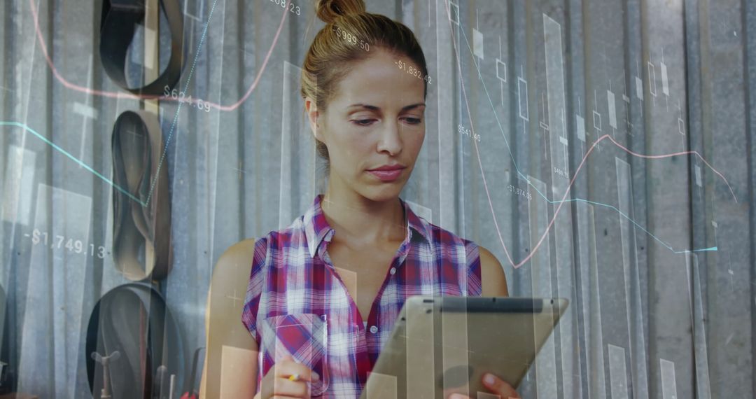 Businesswoman Analyzing Financial Data Using Tablet in Office