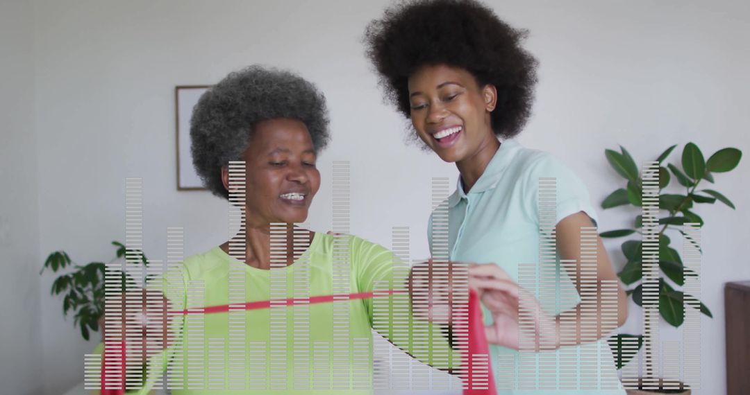 Mother and Daughter Exercising with Resistance Band at Home
