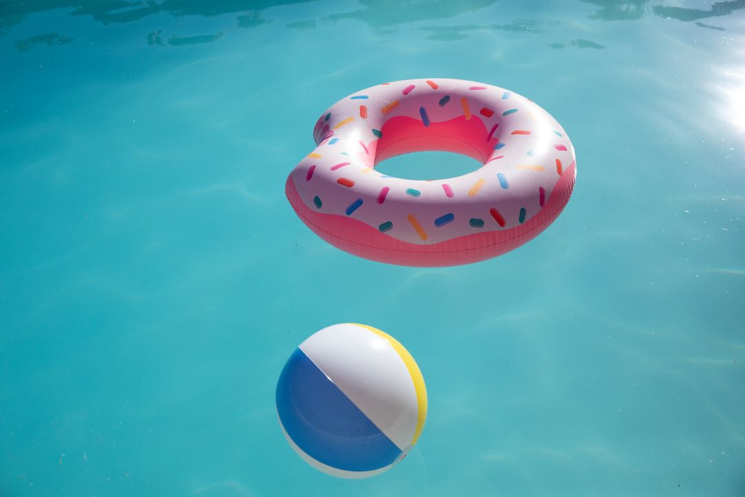 Colorful Pool Day with Donut Float and Beach Ball