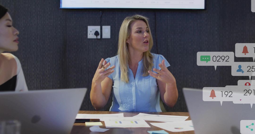 Dynamic Team Meeting with Laptops and Performance Charts