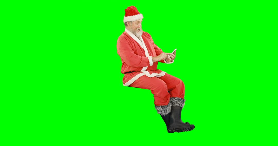 Santa Claus in Red Suit Using Smartphone on Green Screen - Free Images, Stock Photos and Pictures on Pikwizard.com