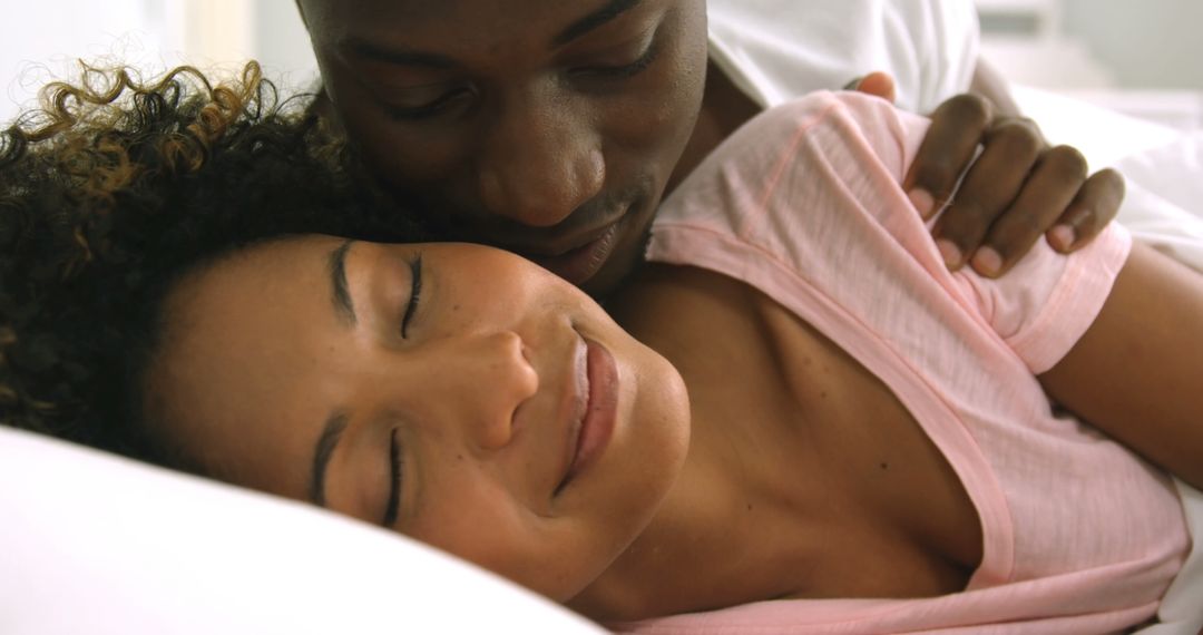 Affectionate Couple Embracing Tenderly in Bed