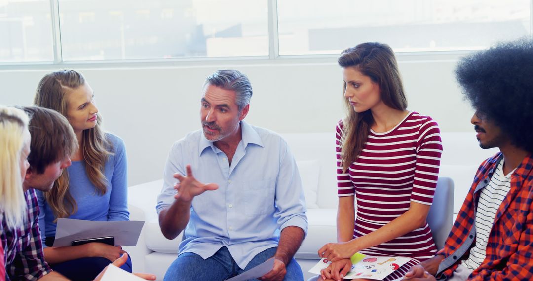Diverse Team Engaging in Thoughtful Office Discussion