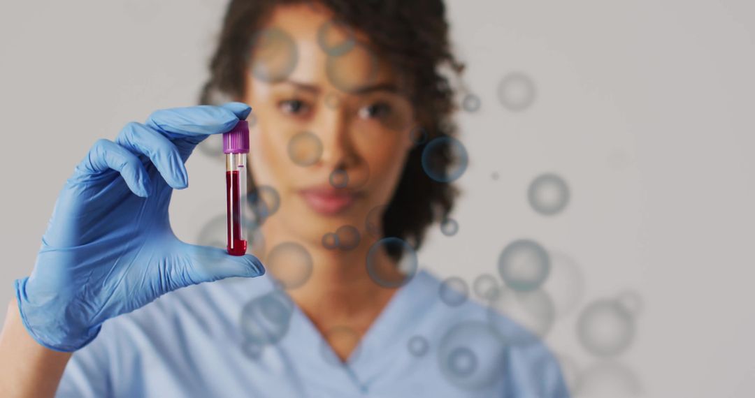 Healthcare Worker Analyzing Blood Sample with Focus