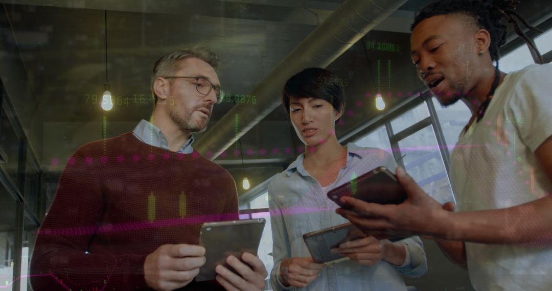Diverse Business Team Analyzing Financial Data on Tablets