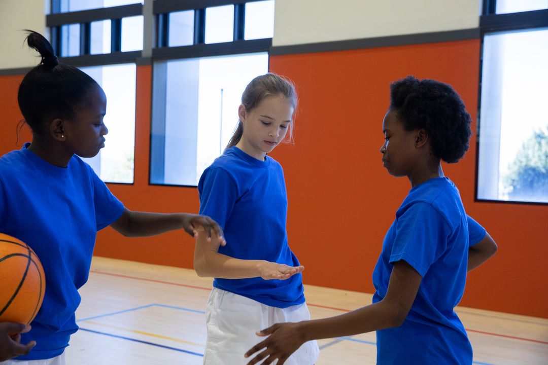 Youth Training Basketball Team Focusing on Sportsmanship and Teamwork Skills