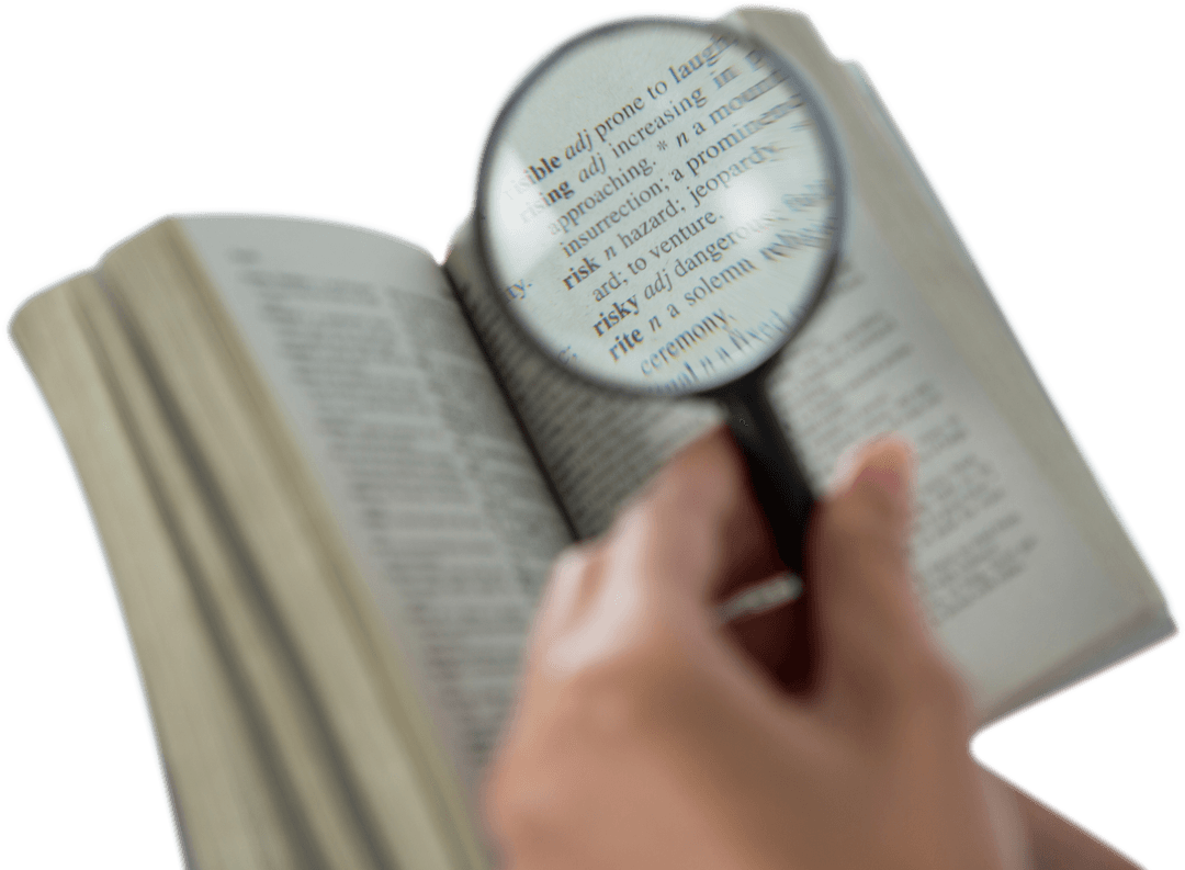 Transparent Close-Up of Hand Holding Magnifying Glass Over Dictionary Text