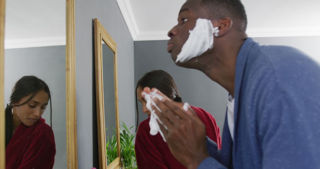 Man Applying Shaving Cream in Bathroom Mirror, Morning Routine - Free Images, Stock Photos and Pictures on Pikwizard.com