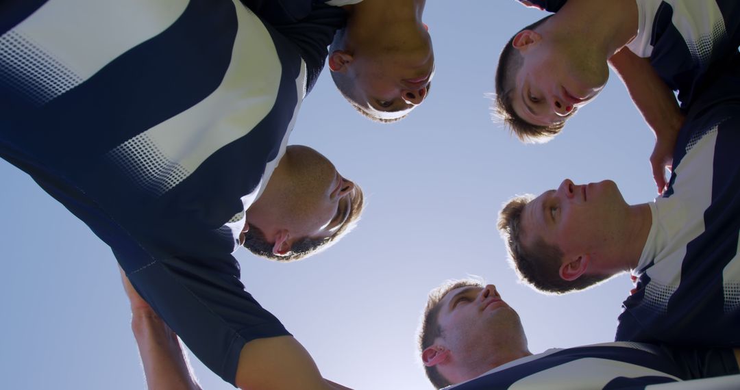 Team Huddle Before Game Under Clear Sky - Free Images, Stock Photos and Pictures on Pikwizard.com