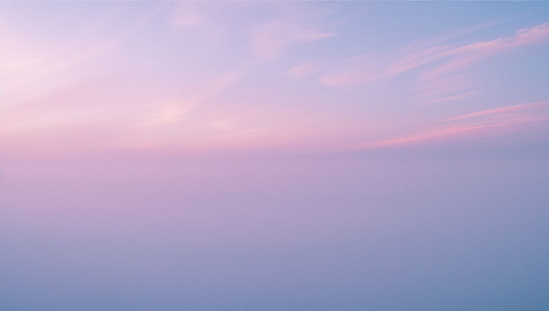 Serene Morning Sky with Pastel Gradient and Wispy Clouds